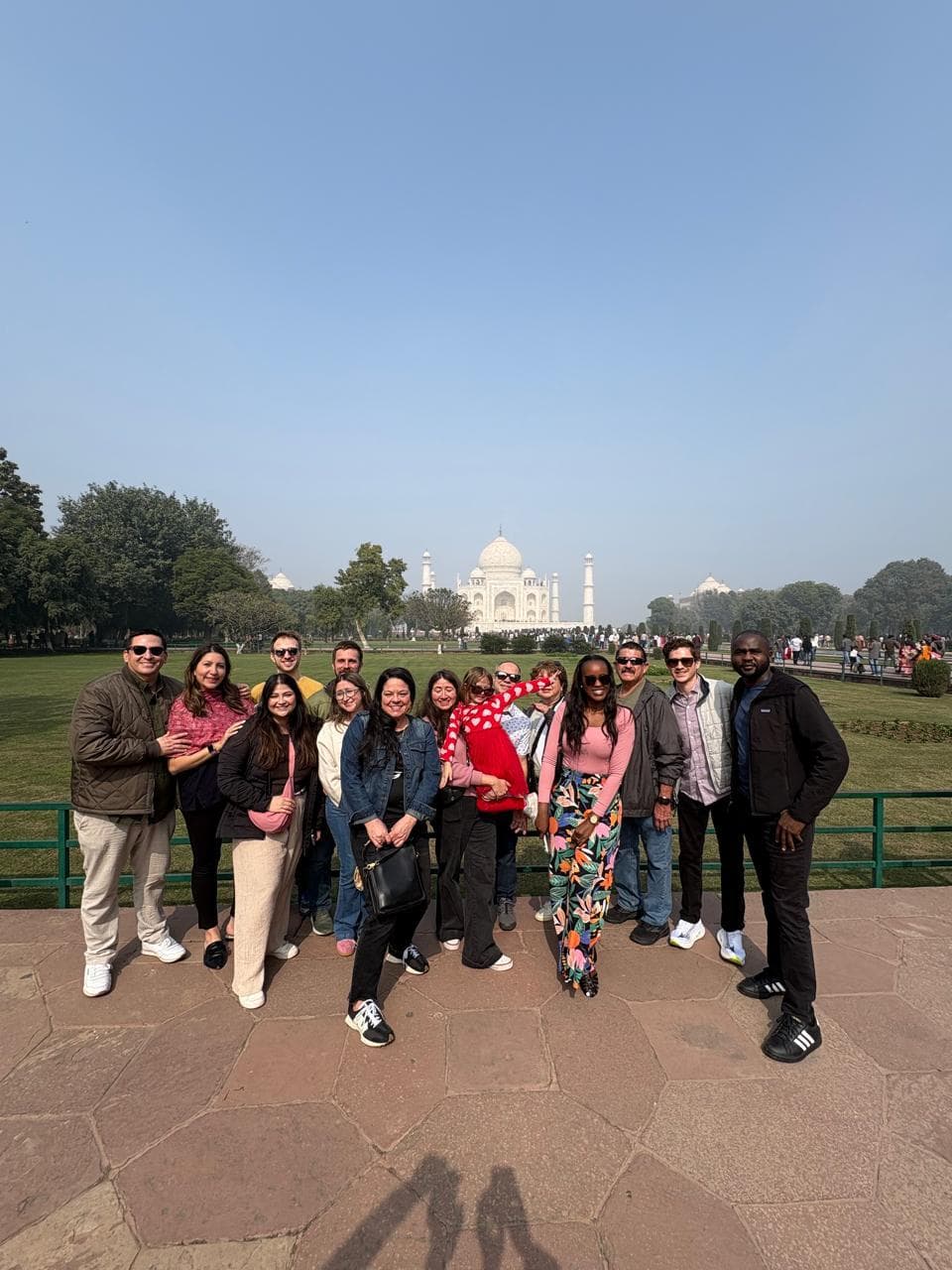A large group of guests in front of the Taj Mahal