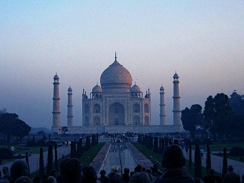 Taj Mahal reflected in the garden pool at dusk