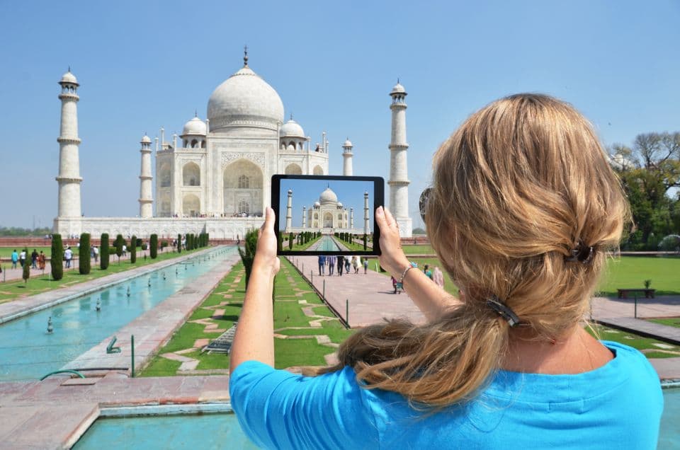 A traveller photographing the Taj Mahal