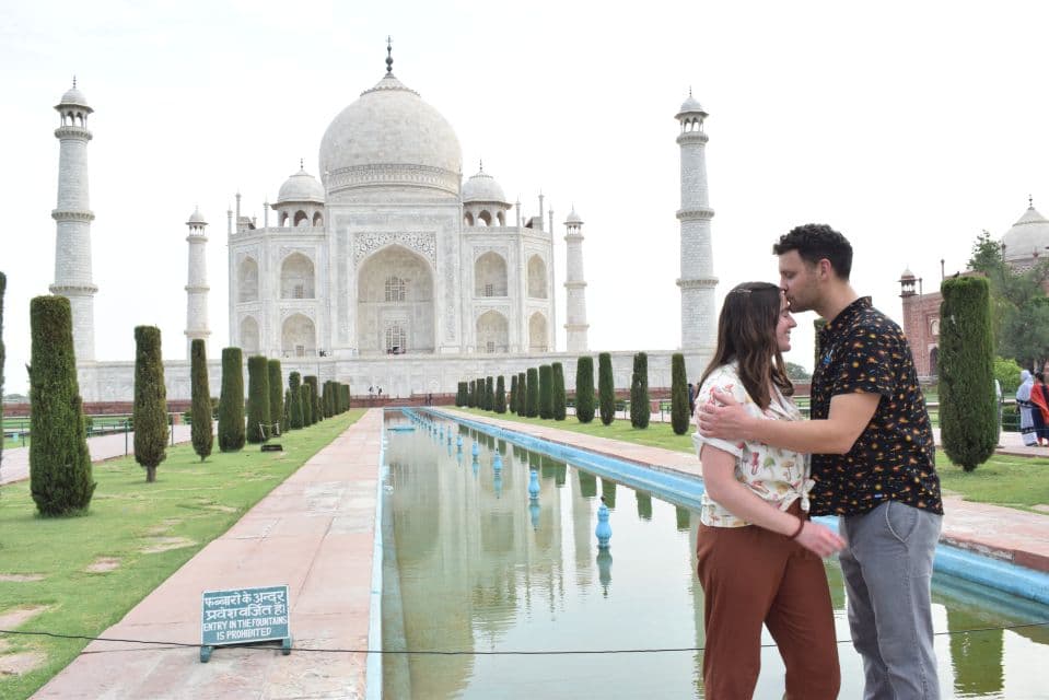 A couple visiting the Taj Mahal