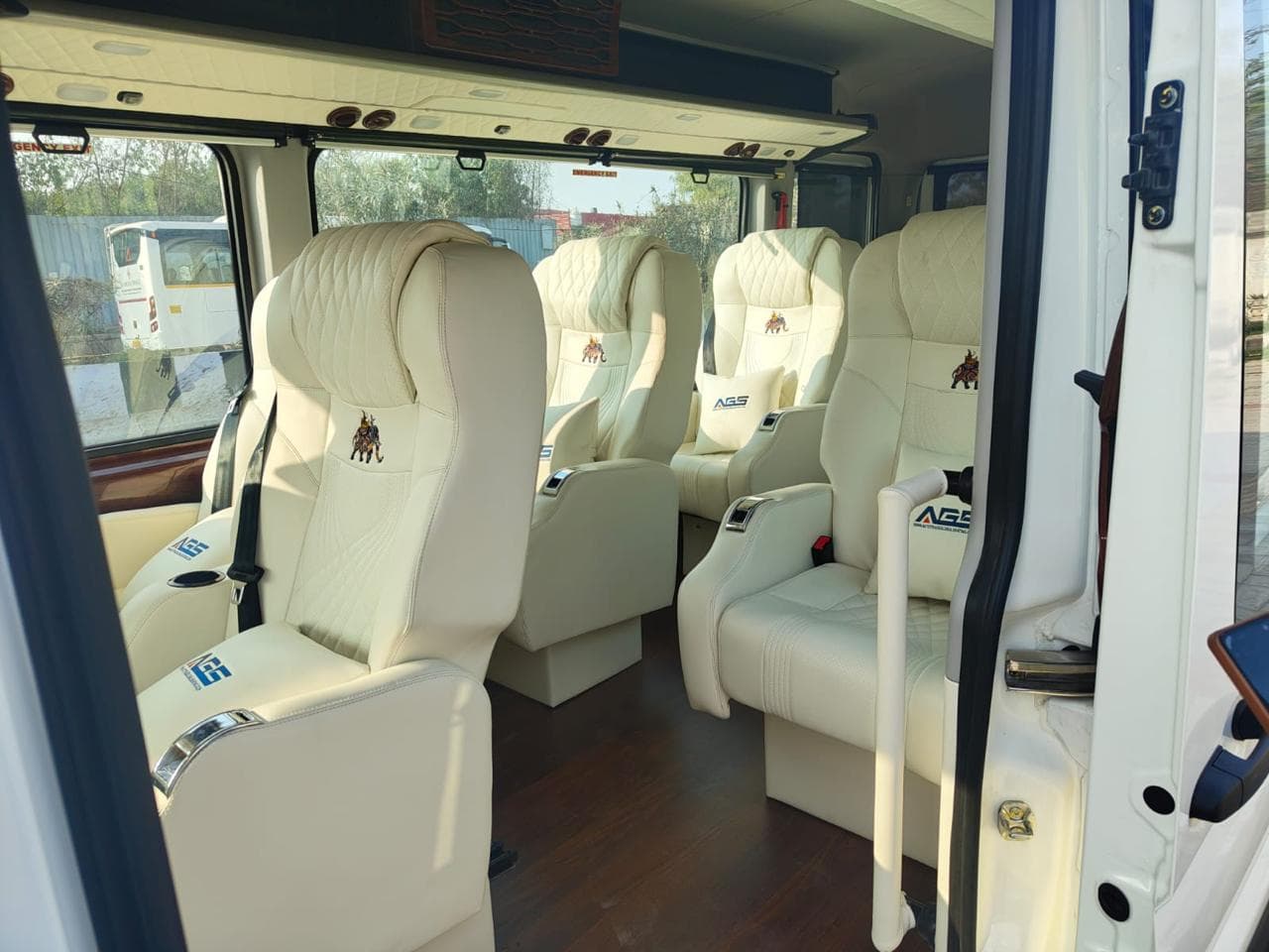View into the cabin through the open door showing plush seating